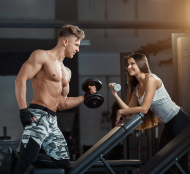 sport-training-fitness-lifestyle-people-concept-young-woman-with-personal-trainer-flexing-back-abdominal-muscles-bench-gym 1