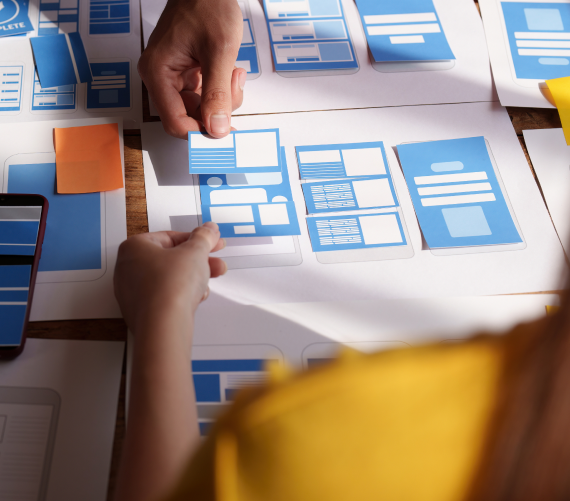 group-ux-developer-ui-designer-brainstorming-about-app-interface-design-modern-office-creative-digital-development-agency 1