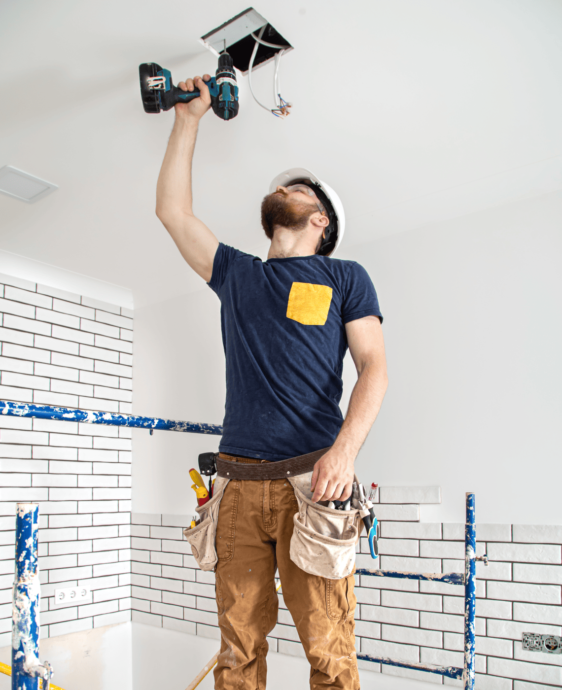 electrician-builder-work-installation-lamps-height-professional-overalls-with-drill-repair-site